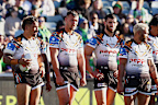 Tigers players wait for a try conversion