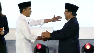 Indonesian President Joko Widodo, left, and his contender Prabowo Subianto.