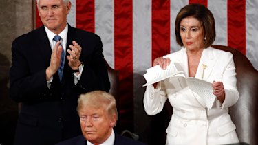 House Speaker Nancy Pelosi tears her copy of President Donald Trump's 2020 State of the Union address after he delivered it to a joint session of Congress. 