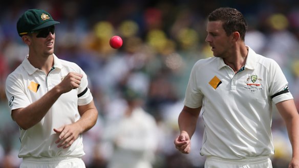 Mitchell Marsh tosses the ball to Josh Hazlewood during the first day-night Test in 2015.