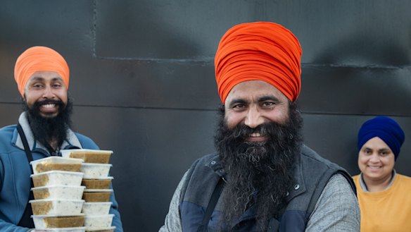 Sikh volunteers Manpreet Singh, Gurkirapal Singh and Sukhwinder Kaur.