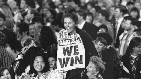 Joanne Hales with an early poster depicting Sydney's win, September 24, 1993.