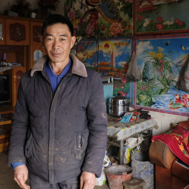 Xia Dongqiao, 49, in his home in Zhuanshanbao, a village in Ludian County, Yunnan.