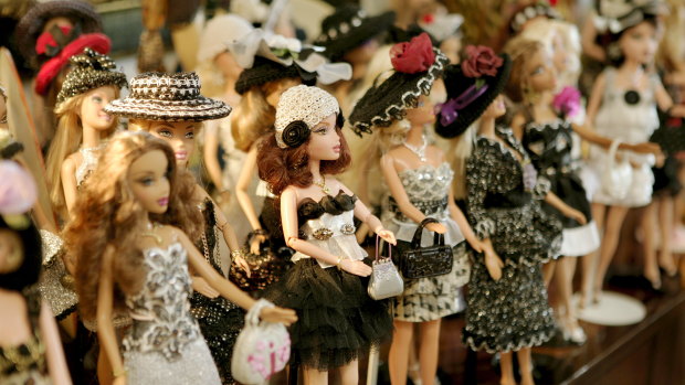 A line-up of Barbie dolls