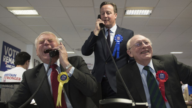 Then British Prime Minister David Cameron helping to campaign in 2016 for a 'Remain' vote in the EU referendum at a phone centre in London along with fellow pro-EU campaigners, Paddy Ashdown, left, and a former Labour leader, Neil Kinnock. 
