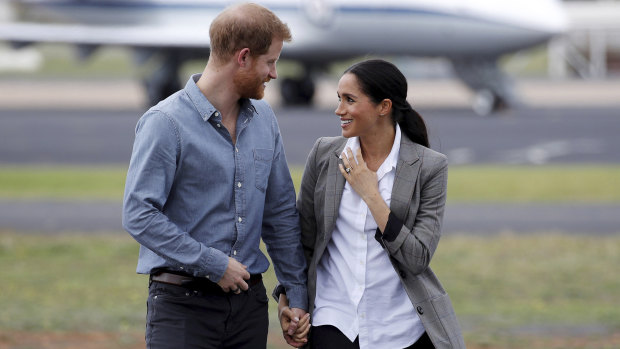 Britain's Prince Harry and Meghan, Duchess of Sussex arrive in Dubbo on Wednesday.