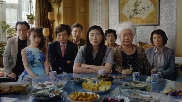 Awkwafina, centre, plays a woman railing against a family lie in The Farewell.