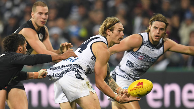 Pussy-footing around: Geelong's Tom Stewart evades a tackle against Carlton.
