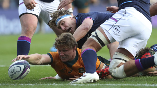 Michael Hooper scored a try but found himself arguing with Romain Poite about a clean out in its build up moments later.