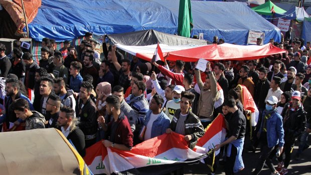 Anti-government protesters gather in Tahrir Square during a sit-in in Baghdad, Iraq.