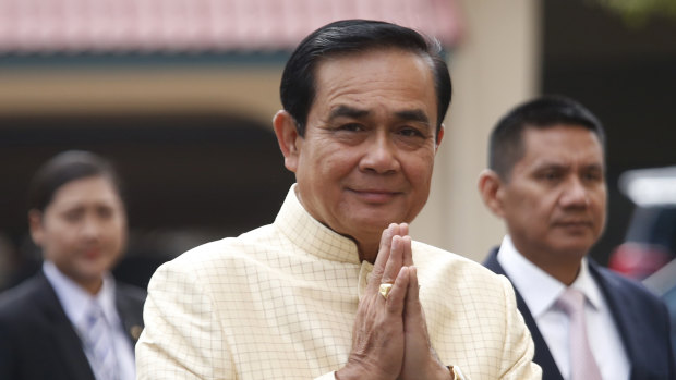 Thai Prime Minister Prayuth Chan-ocha, centre, arrives at Government House on Bangkok for a cabinet meeting.
