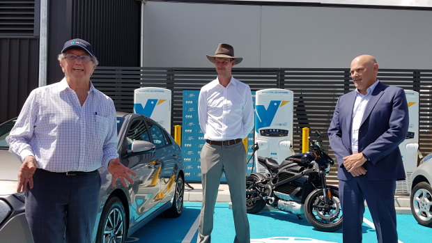 (From left) Evie Networks chairman Trevor St John with Transport Minister Mark Bailey and Martin Ryan from Brisbane Airport Corporation with the new charging stations.