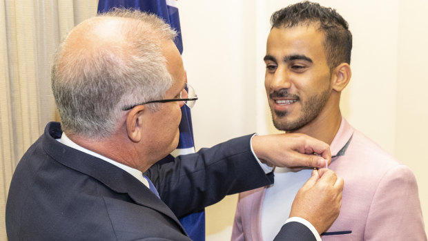 Prime Minister Scott Morrison with Hakeem Al-Araibi following the footballer's release from detention in Thailand in March. 