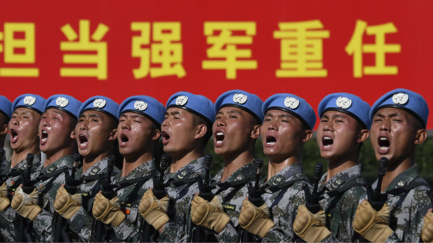 Soldiers practice marching in formation before the military parade to celebrate the 70th anniversary of the founding of the People's Republic of China in Beijing.