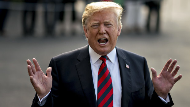 US President Donald Trump speaks to members of the media before boarding Marine One at the White House on Friday.