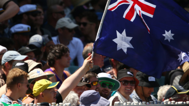 An Aussie fan waves the flag