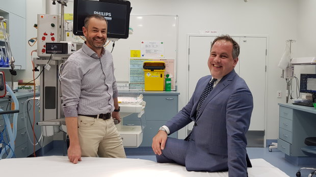 A result to smile about - Chris Gilmour (right) has made a full recovery after being treated by Dr David Rosengren and the RBWH team.