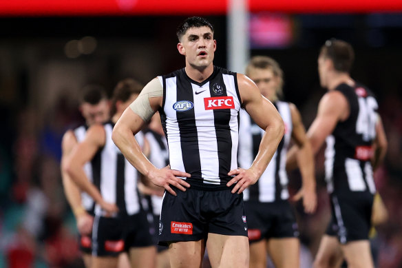 Magpies players react at full-time after their loss to the Sydney Swans.