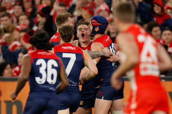 Bayley Fritsch celebrates with Demons teammates.