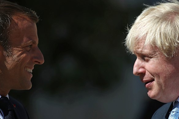 French President Emmanuel Macron welcomes Britain's Prime Minister Boris Johnson at the Elysee Palace ahead of the G7 on Thursday.