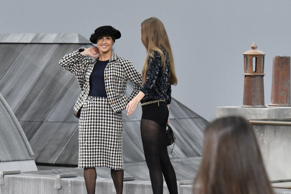Gigi Hadid escorted the runway intruder off stage.