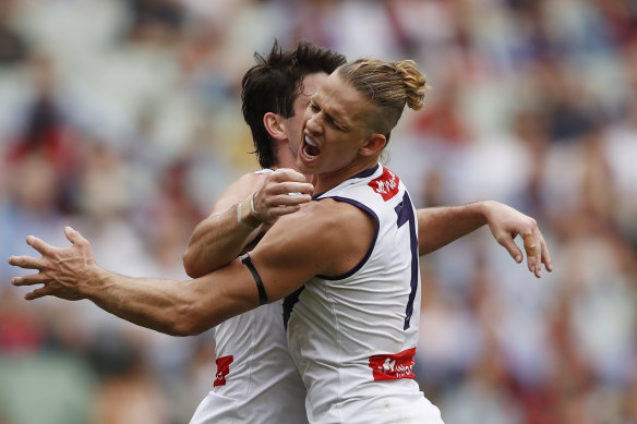 Fremantle’s Andrew Brayshaw celebrates with Nat Fyfe after scoring.