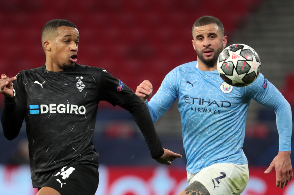Alassane Plea and Kyle Walker  compete for the ball in Budapest.