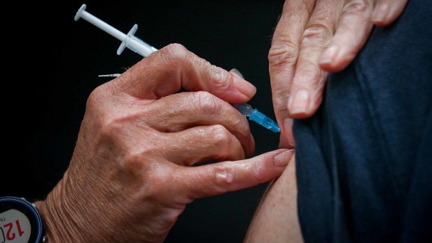 Older Australians told to book COVID-19 booster with flu shot amid immunity concerns