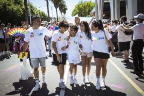 George, centre, and father Costas, brother Peter, sister Elle and mother Roslyn, with the Kind is Cool clothing group in Pride March.