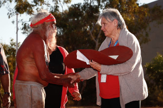 Mutitjulu elder Rolley Mintuma and Pat Anderson from the Referendum Council with a piti holding the Uluru Statement from the Heart during a ceremony at the First Nations National Convention in May 2017, when the Voice to parliament was first proposed. 