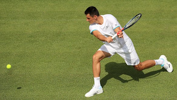 Bernard Tomic's Wimbledon campaign took less than an hour to fizzle out in a straight-sets loss to Jo-Wilfried Tsonga.