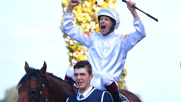 Hugh Bowman roars in triumph as he returns on Farnan after winning the Golden Slipper.
