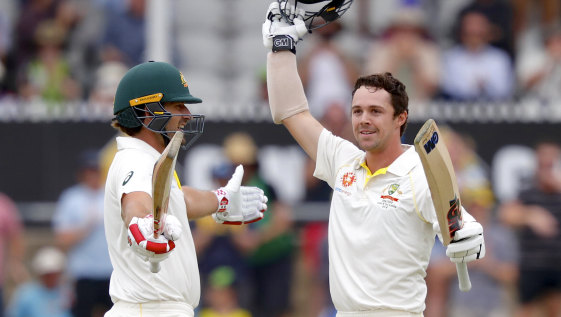 Welcome to the club: Joe Burns congratulates Travis Head on making his first Test hundred.