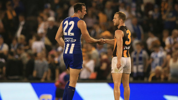 No hard feelings: Todd Goldstein and Tom Mitchell after the siren.