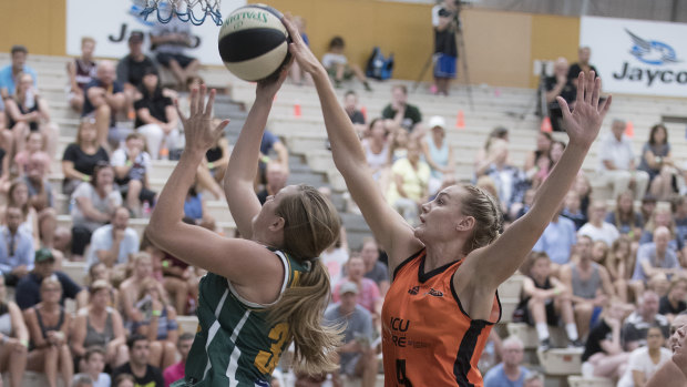 Darcee Garbin, right, playing for the Townsville Fire in the WNBL.