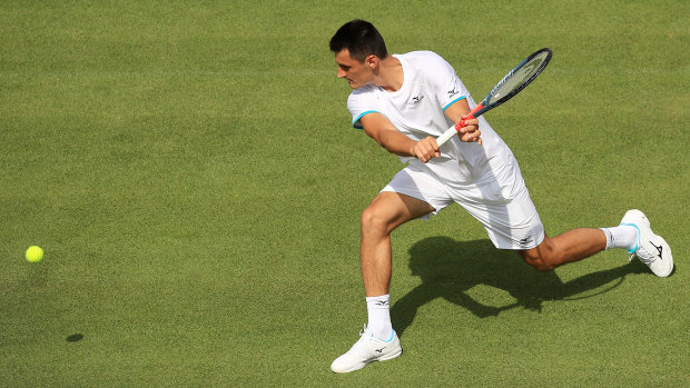 'Unwell': Bernard Tomic's Wimbledon campaign took less than an hour to fizzle out in a straight-sets loss to Jo-Wilfried Tsonga.