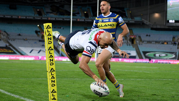 Acrobatic: Blake Ferguson plants the ball over the line in dramatic style.