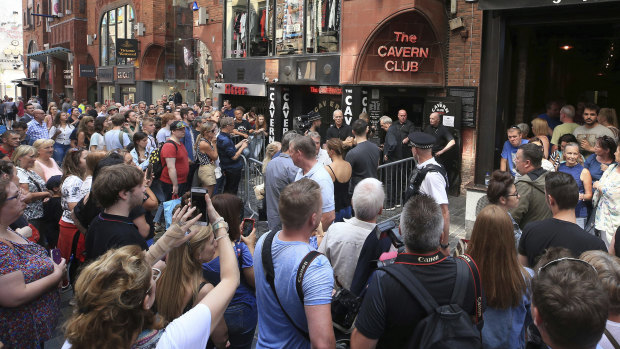 Fans queue outside the Cavern Club before a one-off gig by Sir Paul McCartney in 2018.