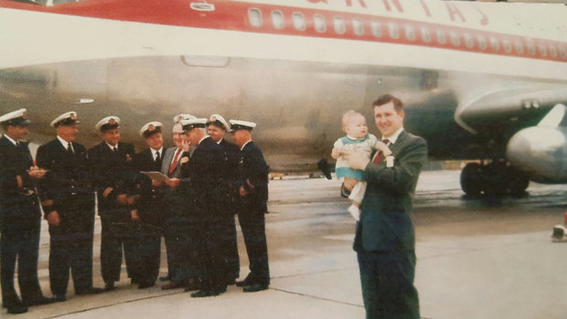Brian Van de Water holds his daughter Sandra at the  Boeing Plant, in August 1959, as the first Boeing 707 was handed over to Qantas for delivery to Australia.   