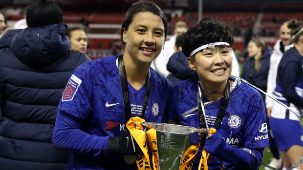 Sam Kerr and Ji So-yun of Chelsea celebrate with the trophy following the FA Women's Continental League Cup final in Nottingham.