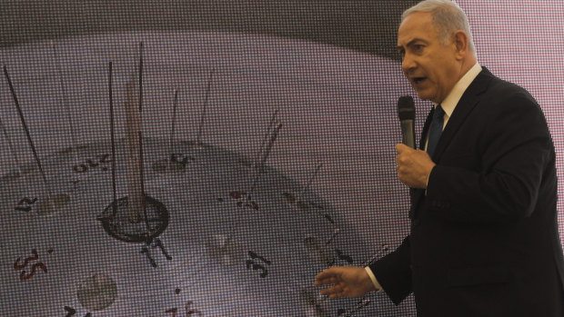 Israeli Prime Minister Benjamin Netanyahu presents material on Iranian nuclear weapons development.