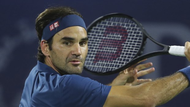 Moving on: Roger Federer needed three sets once more to reach the Dubai last eight.