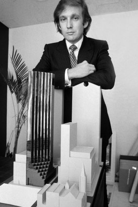 Donald Trump with a Trump Tower model in 1980. It opened to the public on February 14, 1983.