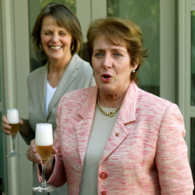 Then-Democrats leader Lyn Allison (back) shares a drink with then-Liberal senator Judith Troeth to celebrate their RU486 bill’s passing on February 16, 2006.