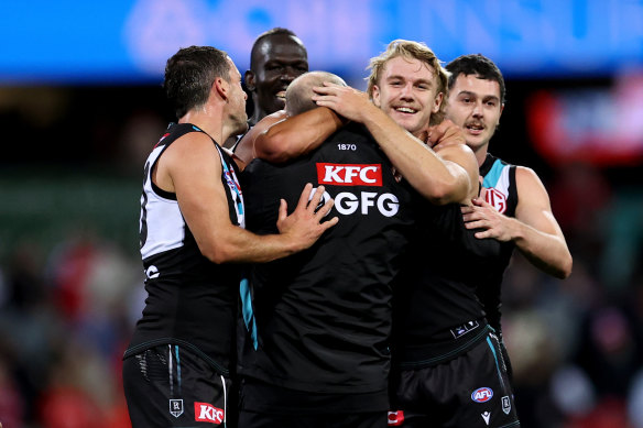 Hinkley celebrates with his players after the win over Sydney in round four.