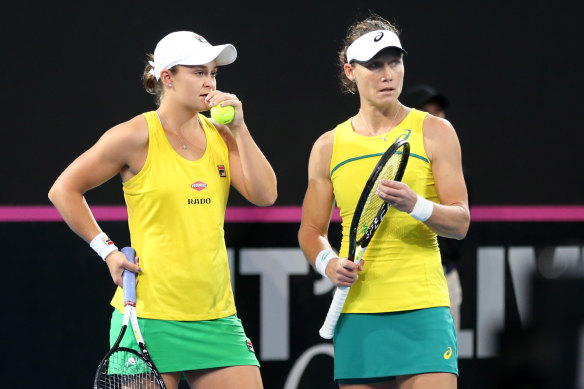 Ashleigh Barty and Sam Stosur in last year's Fed Cup final.  This year's revamped finals were scheduled to begin next week.