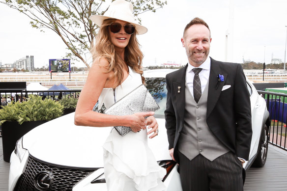 Poser: Lexus Australia CEO Scott Thompson and Elle Macpherson hams it up for the cameras in the Lexus marquee at Derby Day 2018.