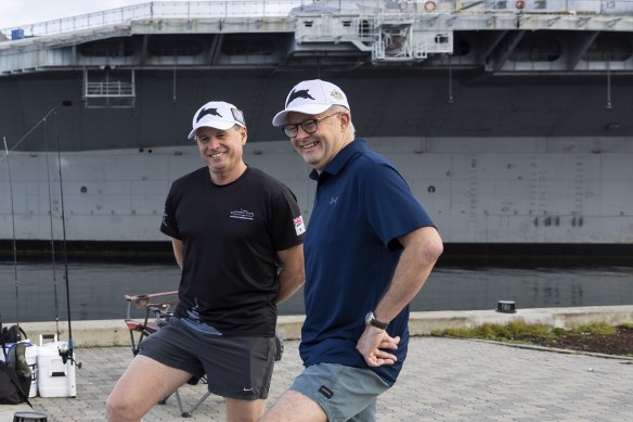 Australian Chief of Navy Vice Admiral Mark Hammond and Prime Minister Anthony Albanese in San Diego, with the USS Midway Museum in the background.