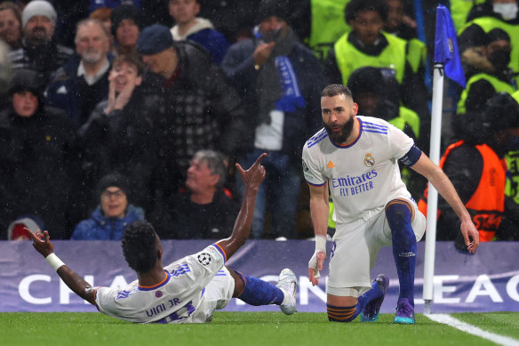 Karim Benzema celebrates the second of his three goals for Real Madrid against Chelsea.