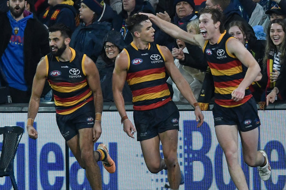Ben Keays (centre) celebrates with teammates, but it wasn’t officially a goal.